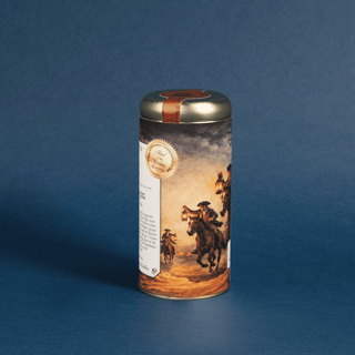Cylindrical coffee canister with colonial riders design on a blue background