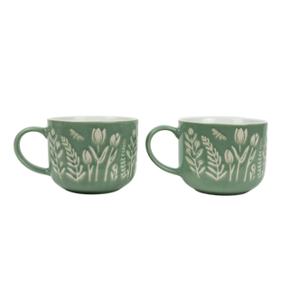 Two green mugs with floral patterns on a white background