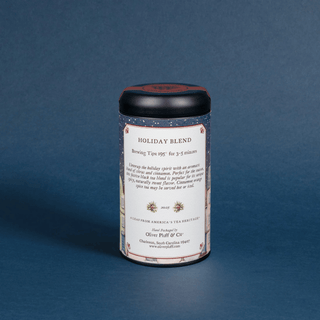 Tea tin labeled 'Holiday Blend' on a blue background