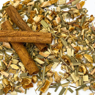 cinnamon sticks and dried tea leaves sprinkled 
