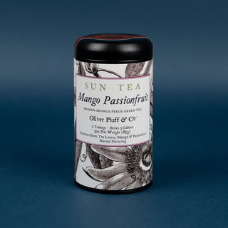 mango passionfruit sun tea tin on blue background