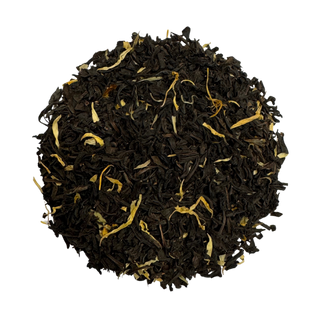 Close-up of black tea leaves on a white background