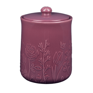 Pink ceramic jar with floral embossing on a transparent background