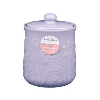 Purple ceramic jar with floral embossing  and sticker that reads 'mason cash' and a lid on a colorless background