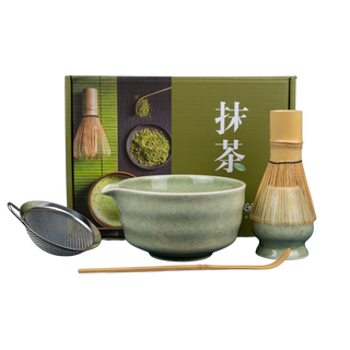 Matcha Gift Set with ceramic bowl, bamboo whisk, whisk holder, matcha scoop, and stainless steel sifter on clear background