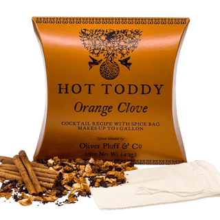 orange firm tea pouch with cinnamon sticks and loose leaf tea sprinkled in front