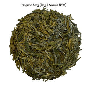 loose green tea leaves in round pile on clear background
