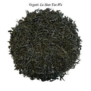 loose green tea leaves in round pile on clear background