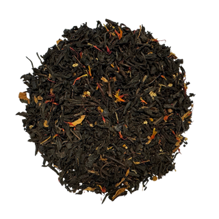 Close-up of black tea leaves on a white background