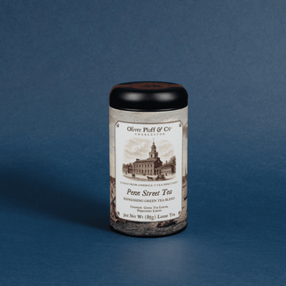 Tea canister with label on a blue background