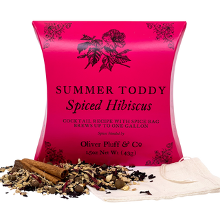Pink packaging of 'Summer Toddy Spiced Hibiscus' with ingredients on a white background
