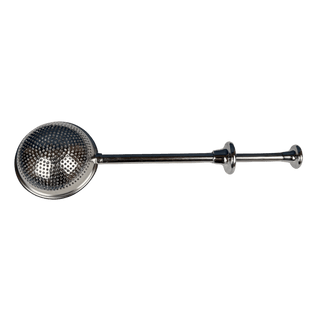 A polished stainless steel tea strainer with a long handle and perforated spherical bowl, shown against a solid green background.