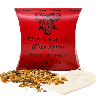red tea pouch with Orange Peel, Ginger, Cinnamon, Allspice, Cloves sprinkled in front and white teabag on counter