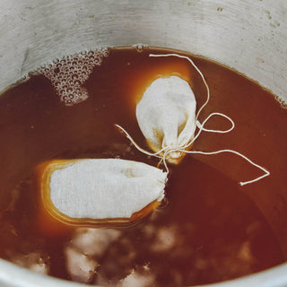 cider wassail spices brewing in brown liquid