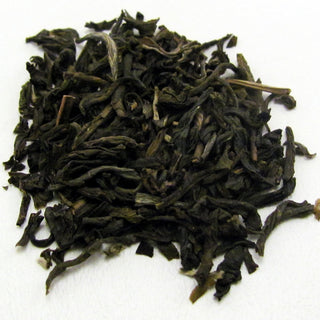 zoomed in view of long golden loose leaf tea pile