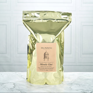 shiny gold tea pouch sitting on white counter