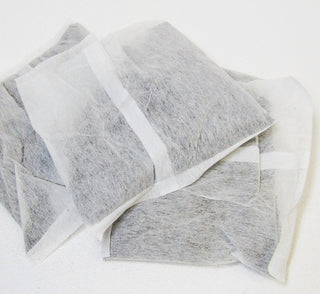 stack of white mesh tea bags