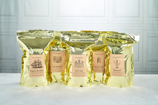 row of 5 shiny tea bag pouches sitting on kitchen counter